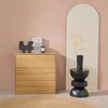 A wooden dresser with decorative items on top, next to a tall arched mirror with dried flowers in a vase. Anteprima dell’immagine prodotto