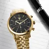 A gold Maserati chronograph watch with a black dial is placed on a planner page next to a black pen. Produktbild-Vorschau