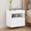 A white floating nightstand with a camera and books on it, next to a bed. Produktbild-Vorschau