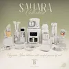 A collection of kitchen appliances and cookware displayed on a gradient background with decorative patterns. Voir les images du produit