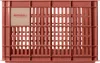 A terra cotta colored plastic crate with a square label on the top left corner. Náhled obrázku produktu