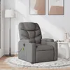 A gray fabric massage chair is placed on a round rug in a room with artwork on the wall and a floor lamp. Produktbild-Vorschau