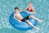 A woman and a boy are in a swimming pool, with the boy sitting in a blue inflatable ring. Náhľad obrázku produktu