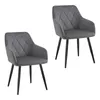 Two grey velvet dining chairs with diamond tufting and black metal legs against a white background. Produktbild-Vorschau