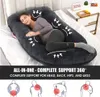 A pregnant woman sleeping on a large U-shaped pillow in a bedroom setting. Náhled obrázku produktu