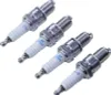 Four spark plugs arranged diagonally on a white background. Náhled obrázku produktu