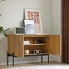 A wooden sideboard with two doors, decorated with artwork and electronic devices, in a room setting. Náhľad obrázku produktu