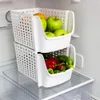 Two white plastic storage bins stacked inside a refrigerator, filled with fruits and vegetables. Anteprima dell’immagine prodotto
