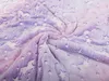 A close-up, swirled view of a soft, fuzzy blanket with a unicorn and star pattern. Anteprima dell’immagine prodotto