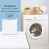 A pillow and bedding are shown next to a washing machine, with care instructions overlaid. Produktbild-Vorschau