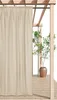 An outdoor curtain hanging from a wooden pergola structure, with a potted plant in the background. Produktbild-Vorschau
