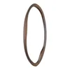 A single, organically shaped mirror with a wooden frame, presented against a white background. Produktbild-Vorschau