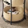 Close-up of a multi-tiered side table with a fabric storage bin. Produktbild-Vorschau