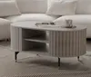 A modern living room with a white sofa and a gray coffee table. Produktbild-Vorschau