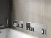 A modern bathroom with a bathtub and built-in shelves. Náhled obrázku produktu