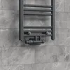 A close-up view of a radiator valve set mounted on a tiled wall. Náhled obrázku produktu