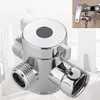 A chrome shower diverter valve is shown against a blurred background of a bathroom. Anteprima dell’immagine prodotto