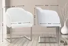 Two white chairs with silver metal frames are shown with dimensions indicated by measurement lines and text. Anteprima dell’immagine prodotto
