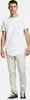 A man wearing a white t-shirt and beige pants, standing against a white background. Produktbild-Vorschau
