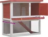 A two-tiered wooden rabbit hutch with red and white coloring, shown with one door open and a ramp leading to the upper level. Náhľad obrázku produktu