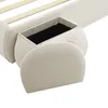A close-up view of a beige upholstered bed frame with a storage compartment visible. Anteprima dell’immagine prodotto