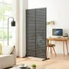 A modern living room or office space with a sofa, a desk with a computer, and a room divider. Voir les images du produit