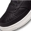 A close-up view of the toe area of a black Nike sneaker with a white sole. Náhľad obrázku produktu