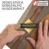 Hands holding samples of leather in different shades of brown. Produktbild-Vorschau