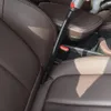 A vacuum cleaner nozzle is being used to clean the crevice between car seats. Produktbild-Vorschau