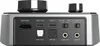 Close-up view of the rear ports and controls of an audio device. Produktbild-Vorschau