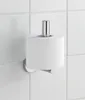 A toilet paper holder with a roll of toilet paper mounted on a tiled wall. Produktbild-Vorschau