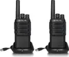 Two black walkie-talkies are shown in their charging docks, each connected to a USB cable. Produktbild-Vorschau