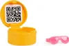 A yellow toy accessory container with a QR code on the lid and pink sunglasses next to it. Anteprima dell’immagine prodotto