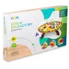 The image shows the retail packaging for a wooden educational activity table for children. Podgląd zdjęcia produktu