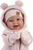 A close-up studio shot of a baby doll wearing a pink knitted outfit. Podgląd zdjęcia produktu