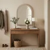 A hallway with a console table, mirror, and decorative items. Náhľad obrázku produktu