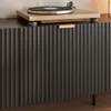 A close-up view of a dark gray ribbed cabinet with a wooden turntable on top. Podgląd zdjęcia produktu