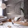 A living room scene with a sofa, armchair, rug, and a wall mural depicting a stone tunnel. Produktbild-Vorschau
