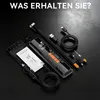 A collection of items related to a portable air compressor, including the compressor itself, cables, adapters, and a manual, laid out on a dark surface. Produktbild-Vorschau