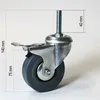 A close-up studio shot of a single caster wheel with a brake. Produktbild-Vorschau