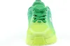 A close-up, front-facing view of a green and yellow sneaker against a white background. Produktbild-Vorschau