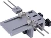 A close-up studio shot of a metal drilling jig. Náhled obrázku produktu