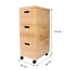 A three-tiered wooden storage unit with wheels, shown against a white background with dimensions indicated. Produktbild-Vorschau