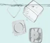 Several parts of a clear plastic food storage container are shown floating in water, with bubbles. Produktbild-Vorschau