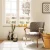 A chair is placed next to a window with natural light coming in. Náhled obrázku produktu