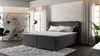 A modern bedroom scene with a bed, shelving unit, and chair. Náhled obrázku produktu