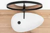A white oval basin is mounted on a black metal frame above a wooden surface. Podgląd zdjęcia produktu