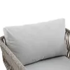 A close-up view of a light gray cushion on a woven chair. Podgląd zdjęcia produktu