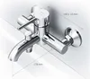 A chrome-finished bathtub faucet mounted on a tiled wall, with dimensions indicated. Produktbild-Vorschau