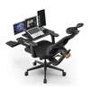 A black ergonomic office chair with multiple monitors and a laptop attached, set up as a workstation. Produktbild-Vorschau